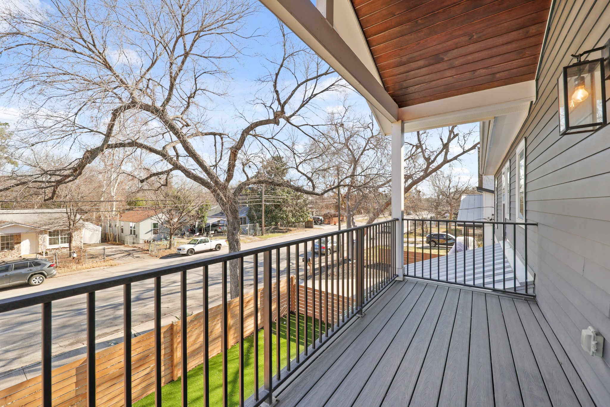 1102 1/2 Tillery Street, Unit 1 Austin, TX 78702 - Photo 26 of 38 a view of balcony with wooden floor and fence