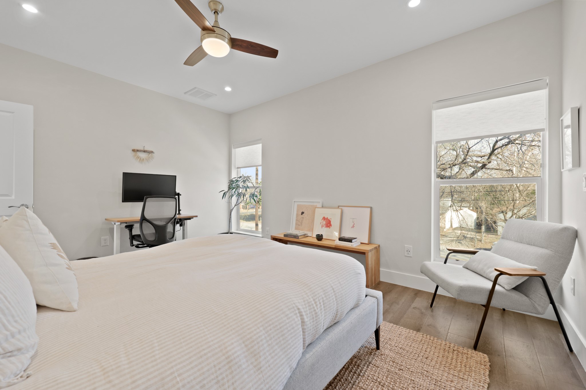 1102 1/2 Tillery Street, Unit 1 Austin, TX 78702 - Photo 33 of 38 a bedroom with a bed and chair