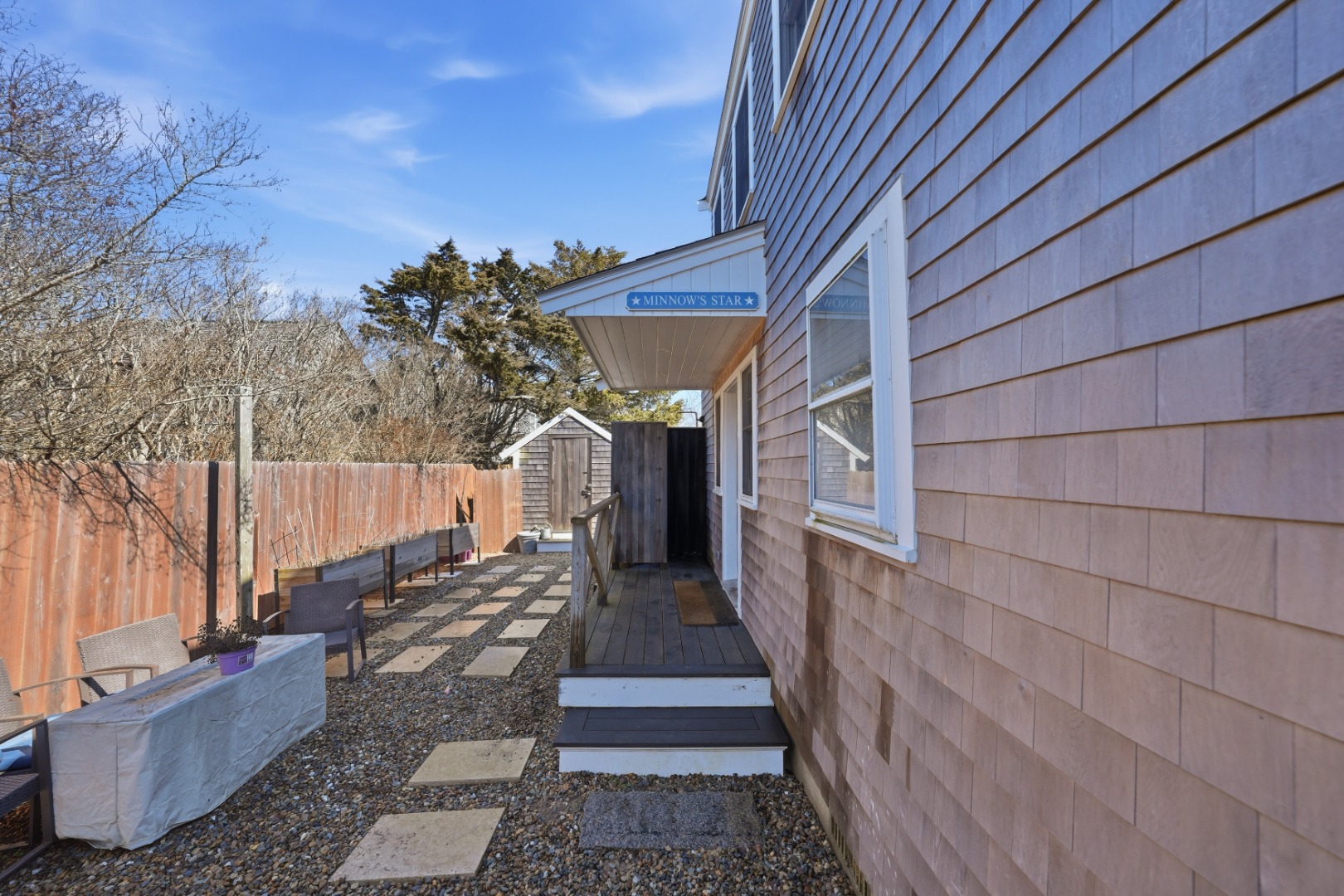 1 H Street Nantucket, MA 02554 - Photo 17 of 18 a view of a pathway of a house with wooden floor