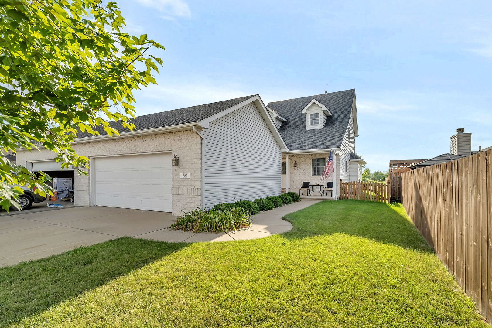 220 South Will Road, Unit 2 Diamond, IL 60416 - Photo 1 of 26 a front view of a house with garden