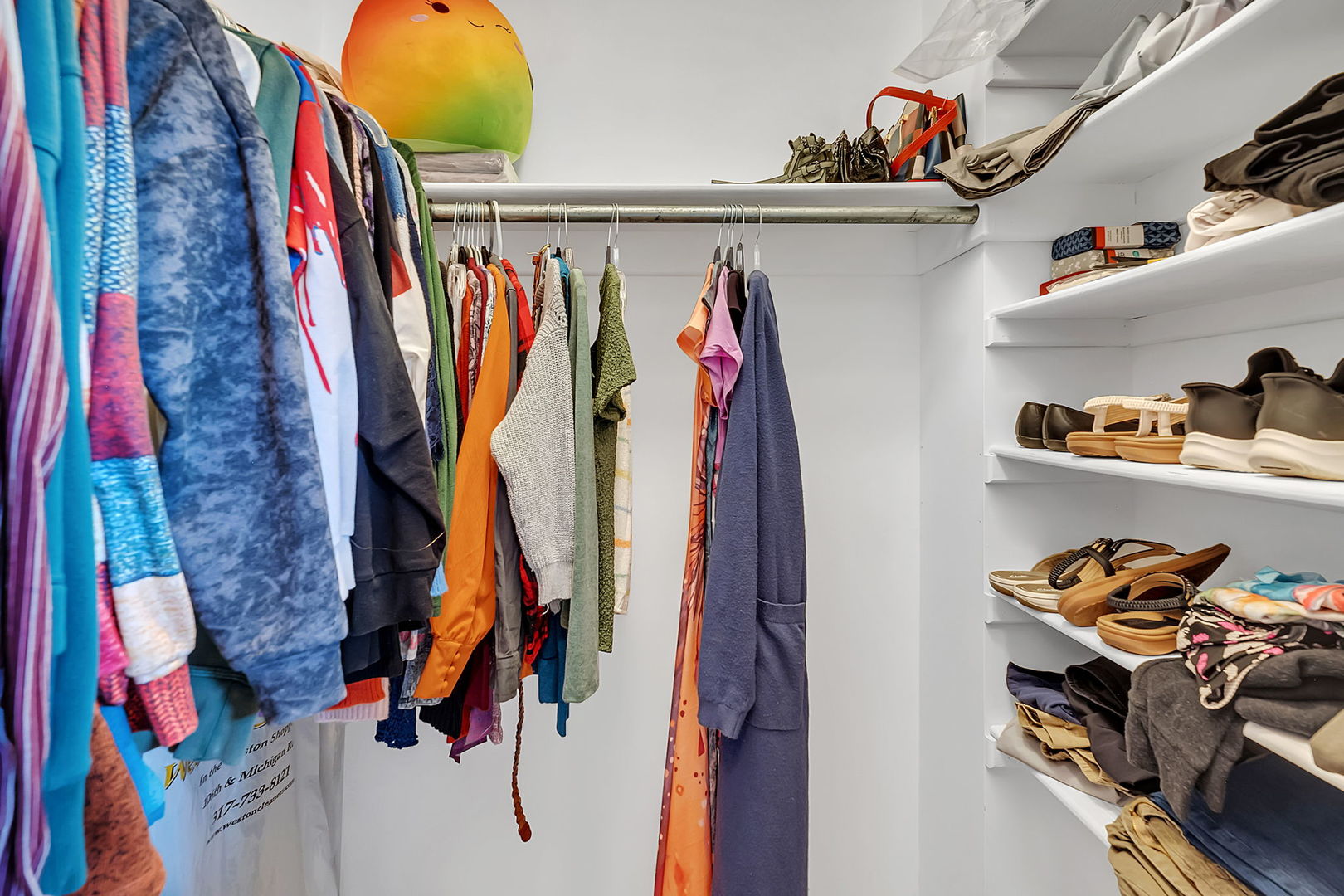 220 South Will Road, Unit 2 Diamond, IL 60416 - Photo 16 of 26 a view of walk in closet with clothes and shoes