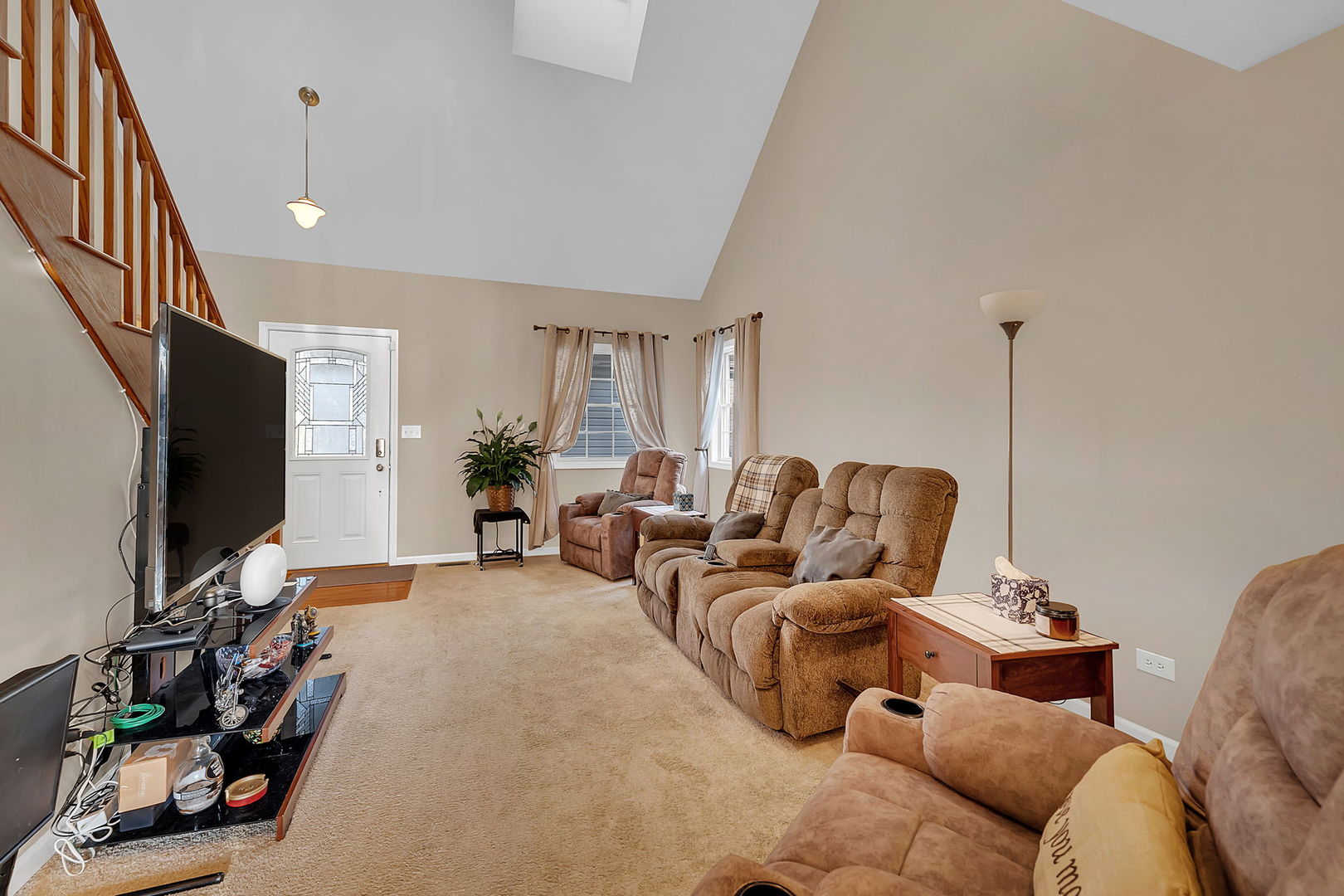 220 South Will Road, Unit 2 Diamond, IL 60416 - Photo 7 of 26 a living room with furniture and a flat screen tv