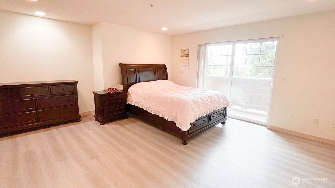 1001 West Casino Road, Unit G303 Everett, WA 98204 - Photo 13 of 22 a bedroom with a bed and window