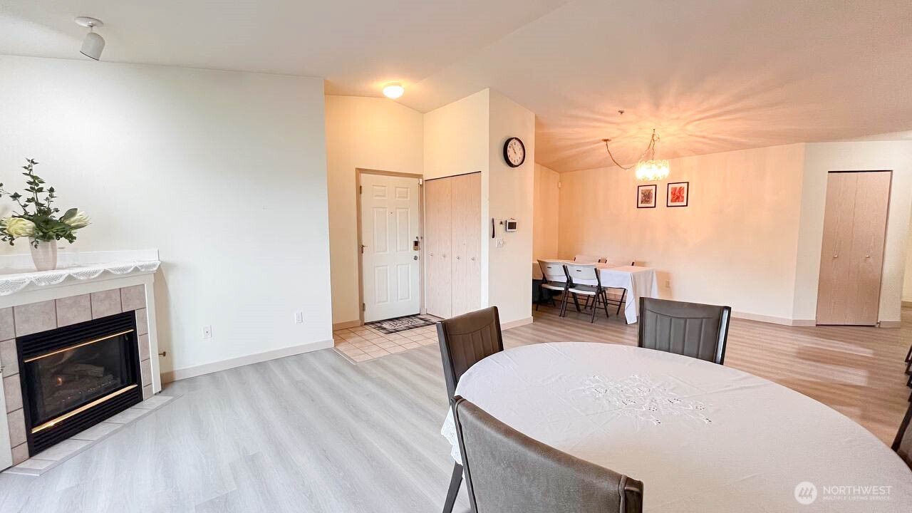 1001 West Casino Road, Unit G303 Everett, WA 98204 - Photo 3 of 22 a living room with furniture and a fireplace