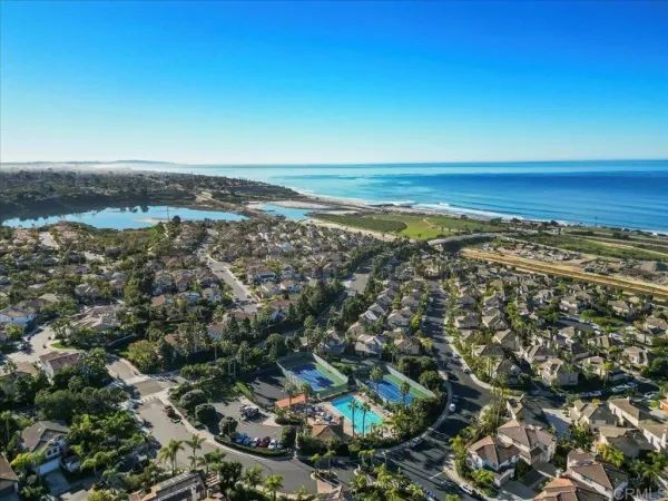 an aerial view of residential houses with outdoor space