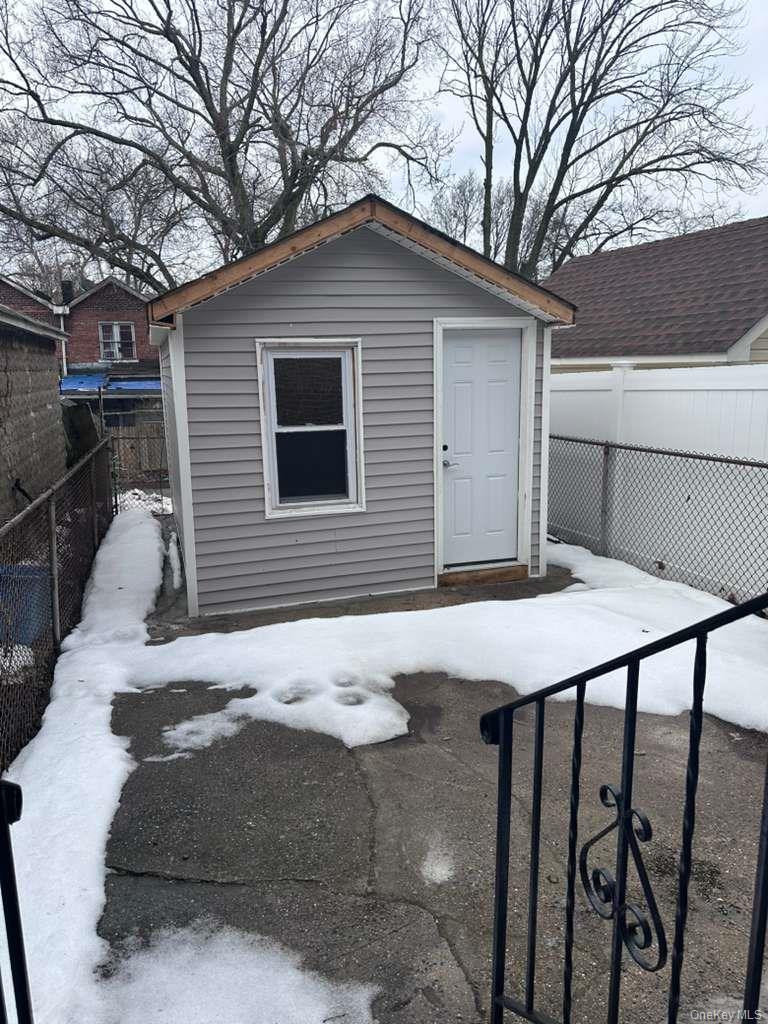 114-06 Inwood Street Queens, NY 11436 - Photo 13 of 18 View of outbuilding with a fenced backyard