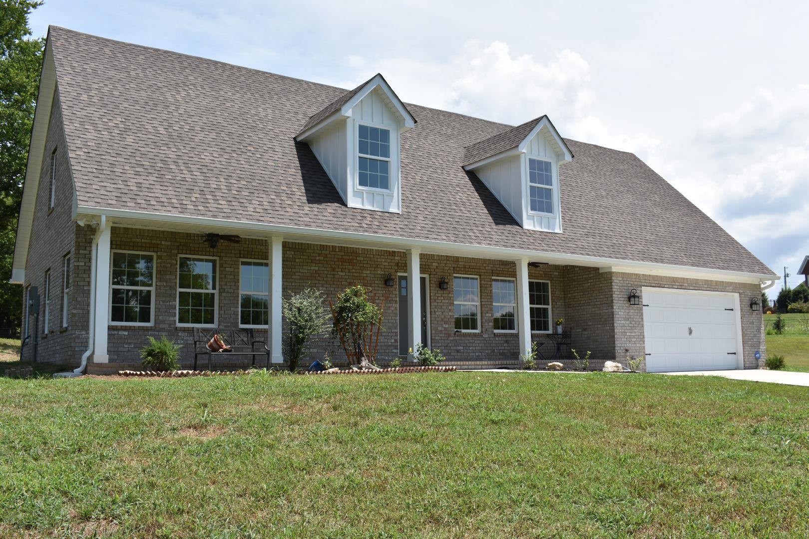 2107 Double Branch Road Columbia, TN 38401 - Photo 1 of 29 front view of a brick house with a yard