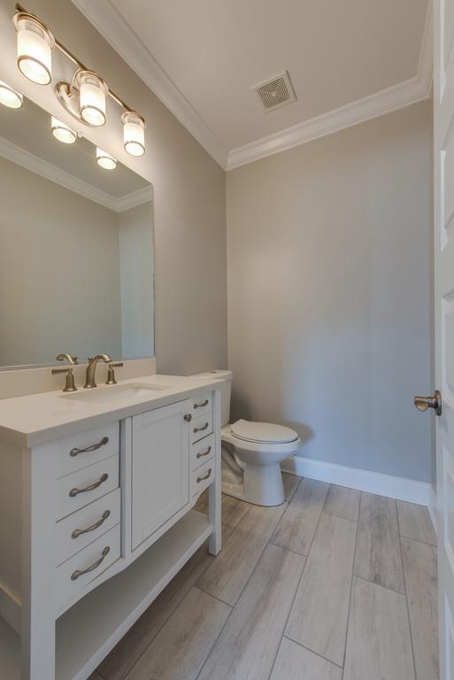 2107 Double Branch Road Columbia, TN 38401 - Photo 12 of 29 a bathroom with a sink a toilet and a mirror