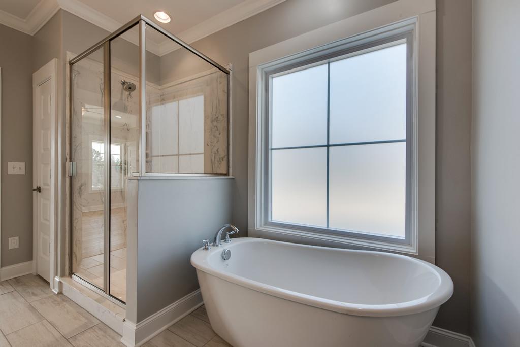 2107 Double Branch Road Columbia, TN 38401 - Photo 17 of 29 a bathroom with a tub and shower
