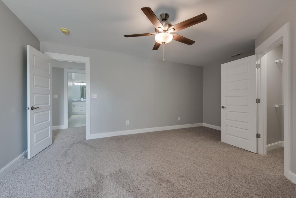 2107 Double Branch Road Columbia, TN 38401 - Photo 21 of 29 an empty room with closet and windows