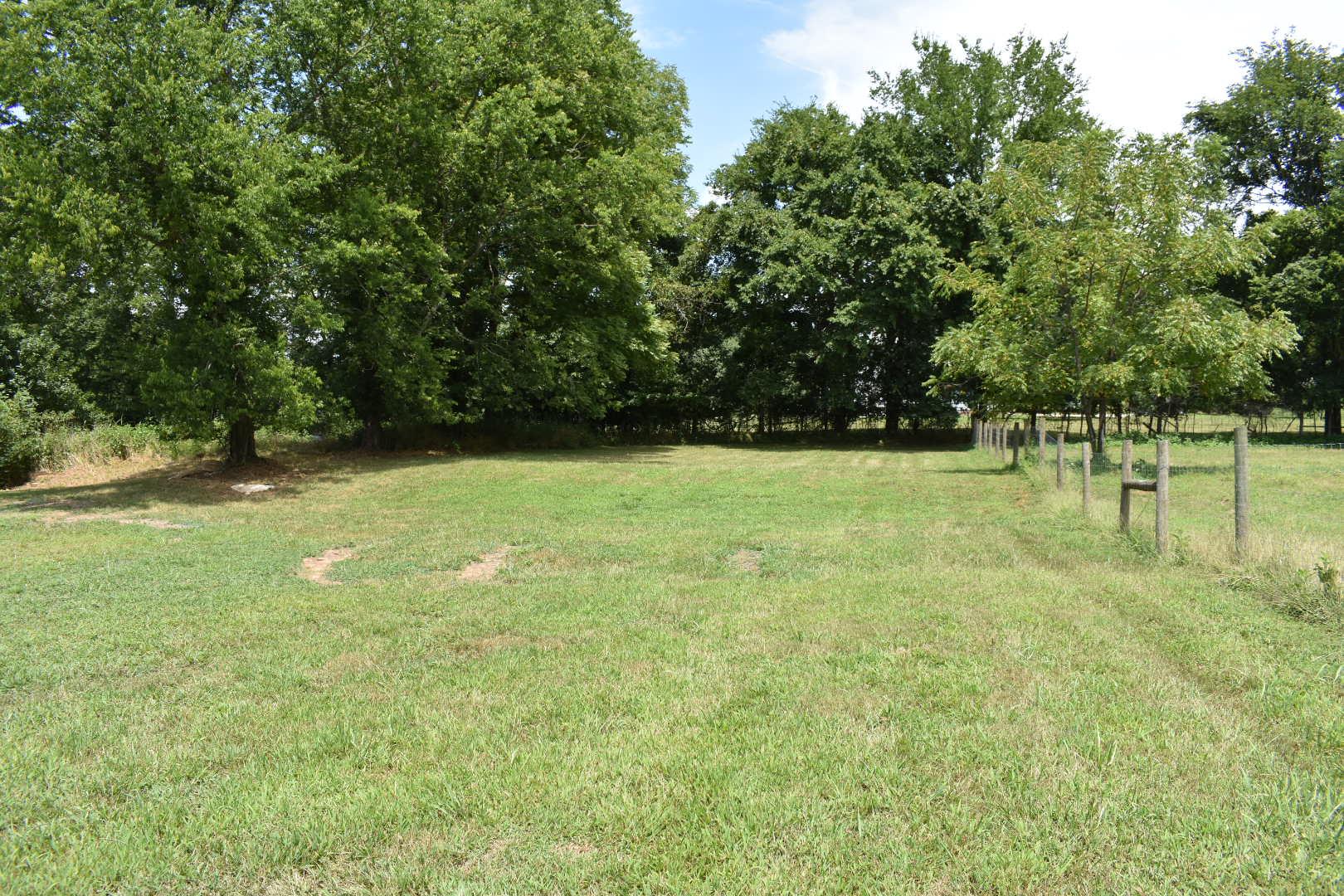 2107 Double Branch Road Columbia, TN 38401 - Photo 27 of 29 a view of outdoor space with a garden and trees