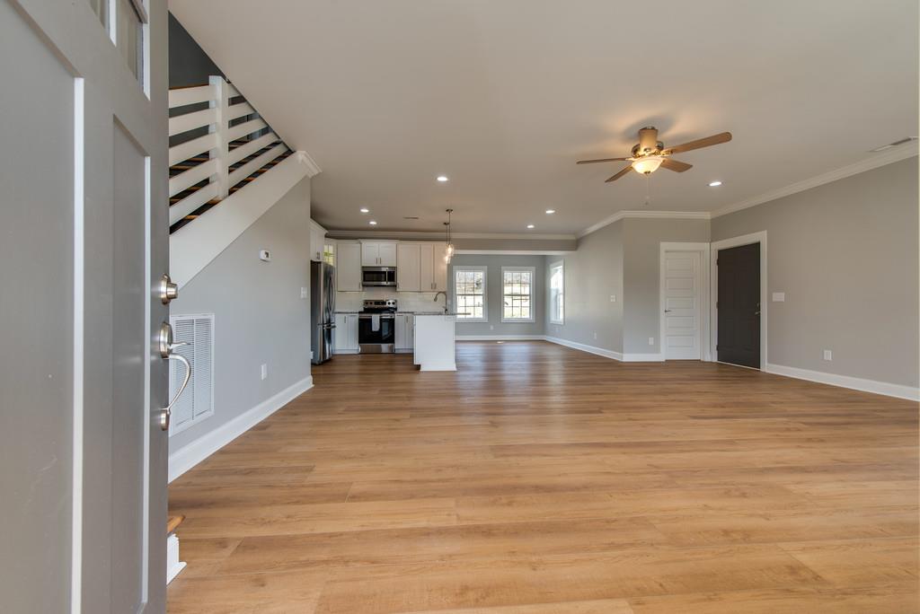 2107 Double Branch Road Columbia, TN 38401 - Photo 6 of 29 a view of an empty room with kitchen view and a window