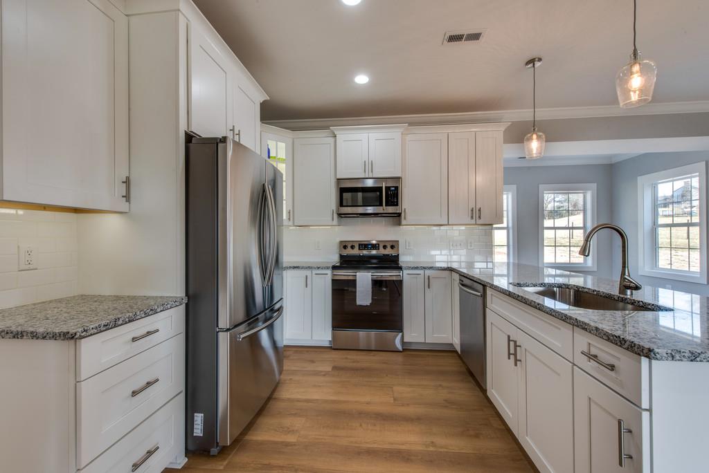 2107 Double Branch Road Columbia, TN 38401 - Photo 9 of 29 a kitchen with a refrigerator and a sink