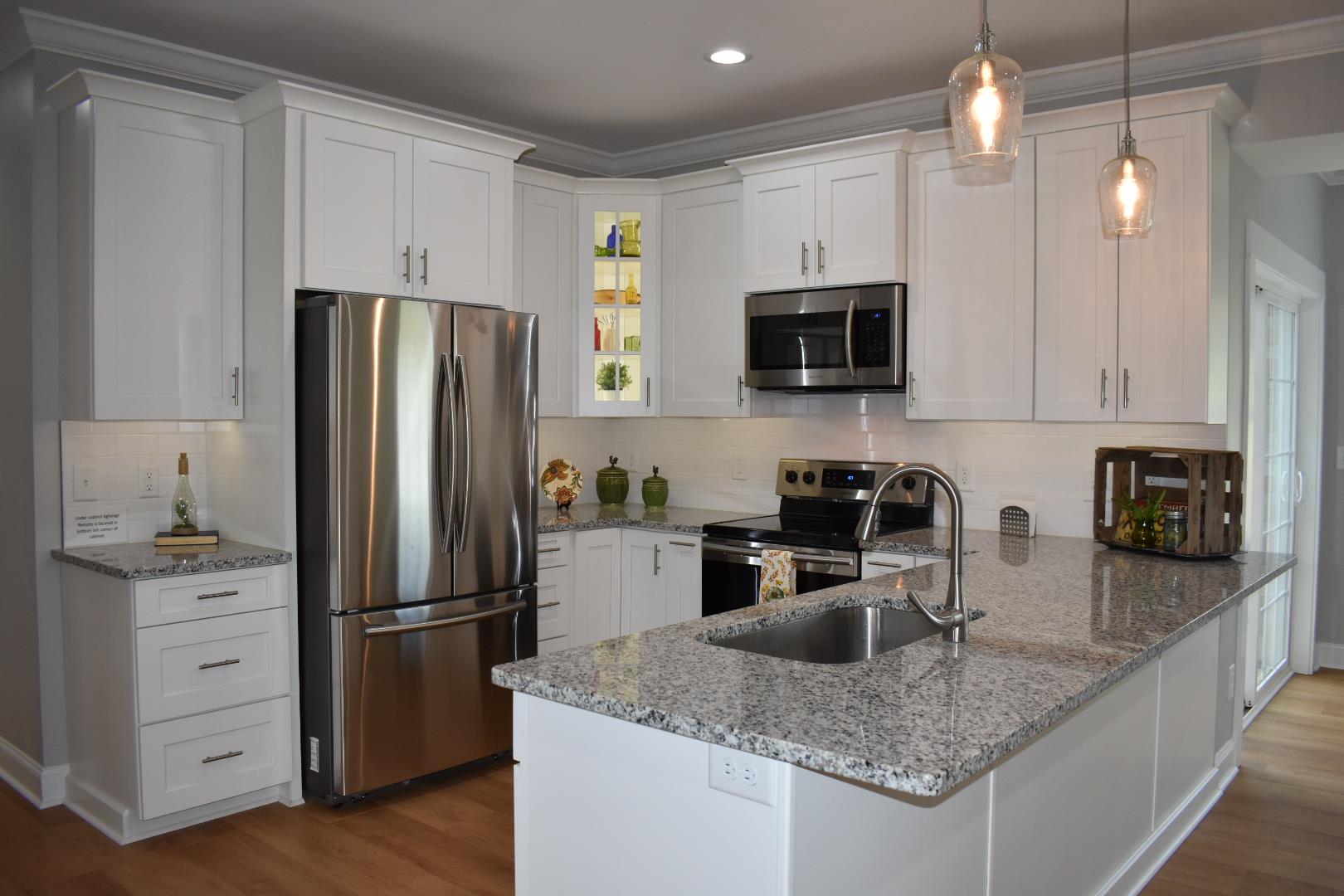 2107 Double Branch Road Columbia, TN 38401 - Photo 10 of 29 a kitchen with a refrigerator a microwave a sink and cabinets