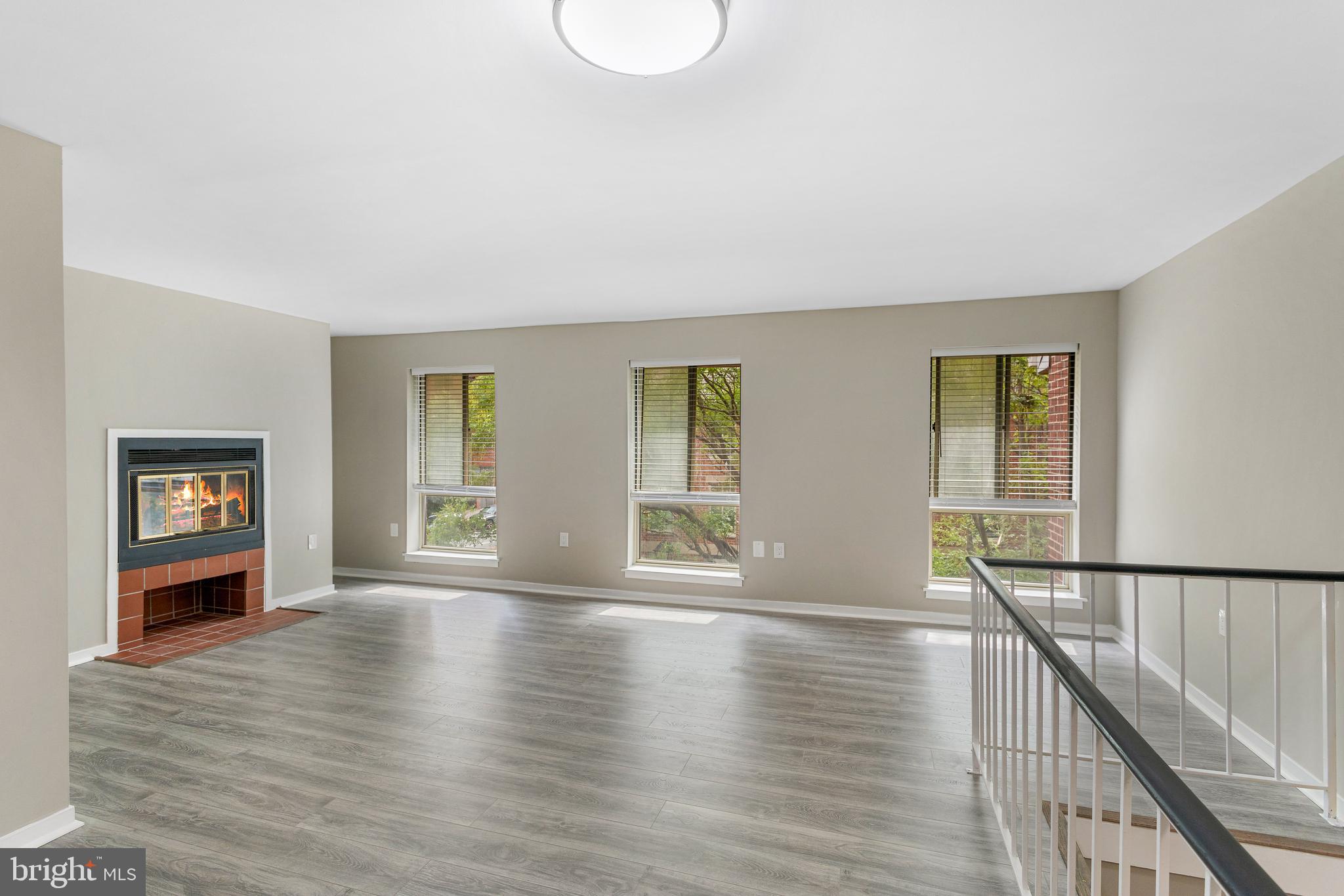 22 Andrew Place, Unit R126 Baltimore, MD 21201 - Photo 7 of 33 Sun streams through large windows