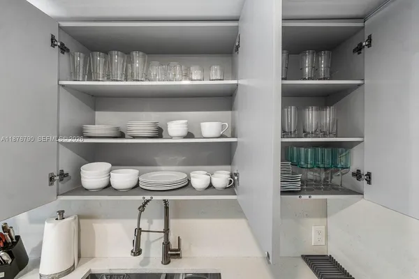 a bedroom with a bed a large window with outer view