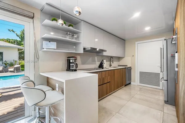 a living room with furniture and white walls