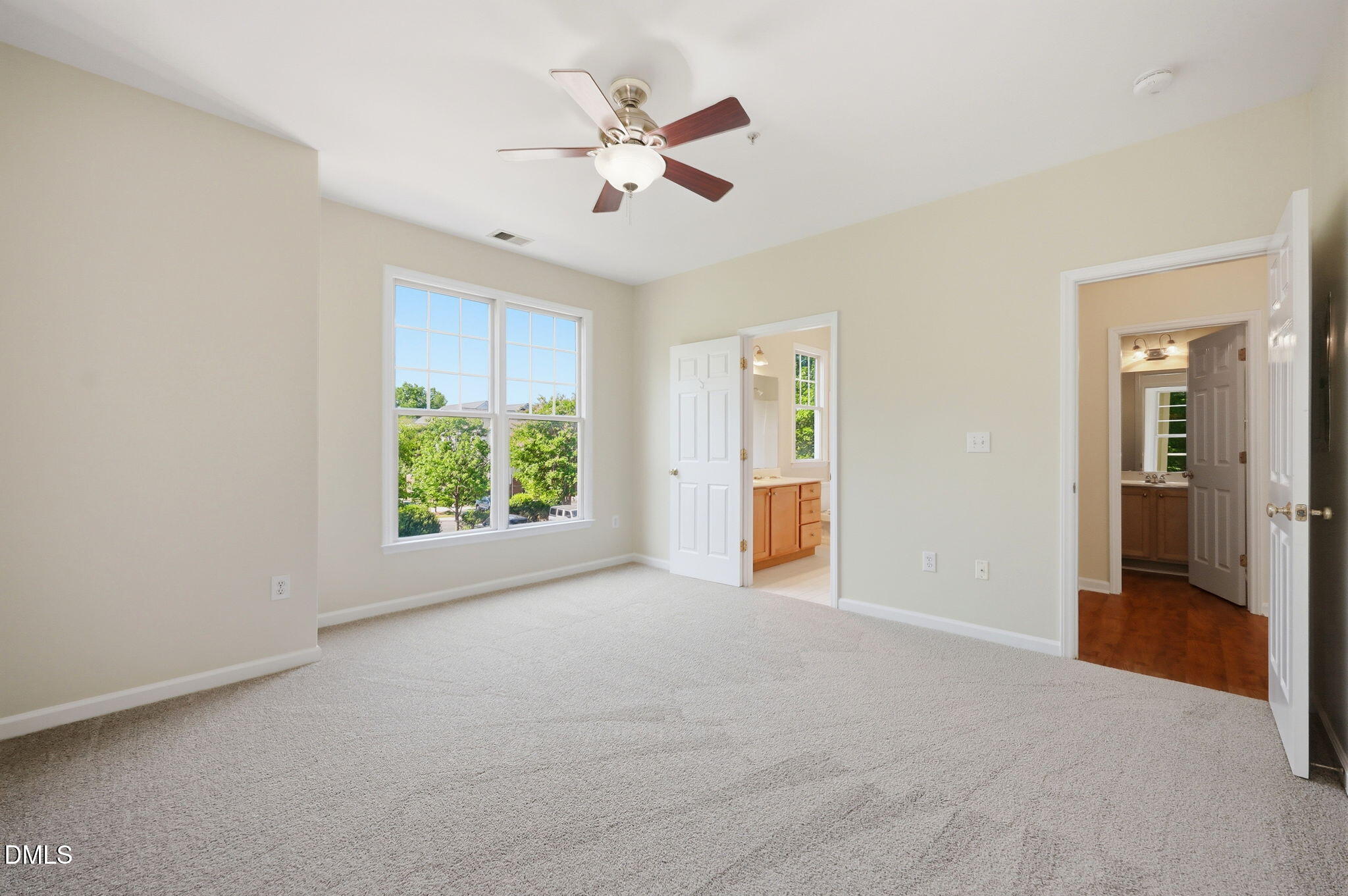 801 Moratuck Drive, Unit 202 Raleigh, NC 27604 - Photo 14 of 23 an empty room with fan and windows