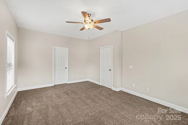 a view of a livingroom with a ceiling fan