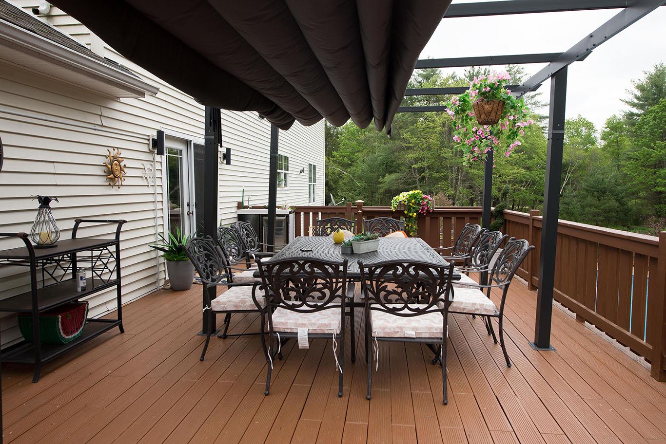 16 Kukas Road Monticello, NY 12701 - Photo 41 of 47 a view of a patio with table and chairs and wooden floor