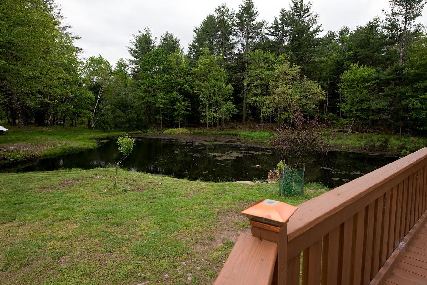 16 Kukas Road Monticello, NY 12701 - Photo 45 of 47 a wooden bench sitting in the middle of a park