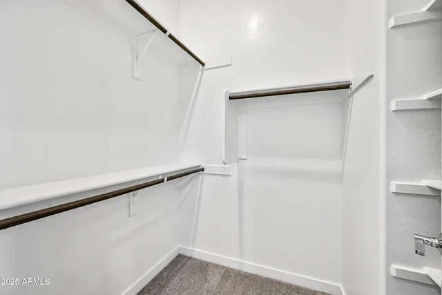 a view of an empty walk in closet