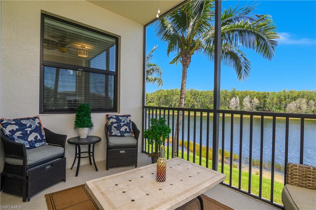 9554 Trevi Court, Unit 4727 Naples, FL 34113 - Photo 14 of 50 a view of a patio with a table chairs and a potted plant
