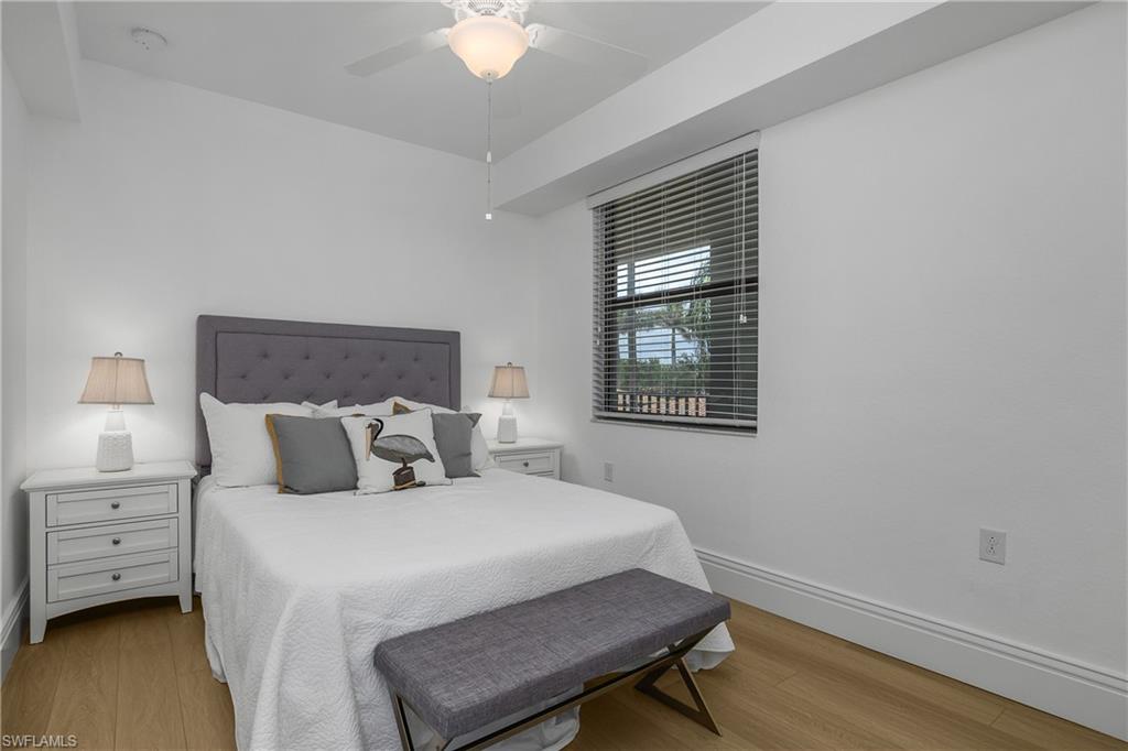 9554 Trevi Court, Unit 4727 Naples, FL 34113 - Photo 21 of 50 a bedroom with a bed and a window