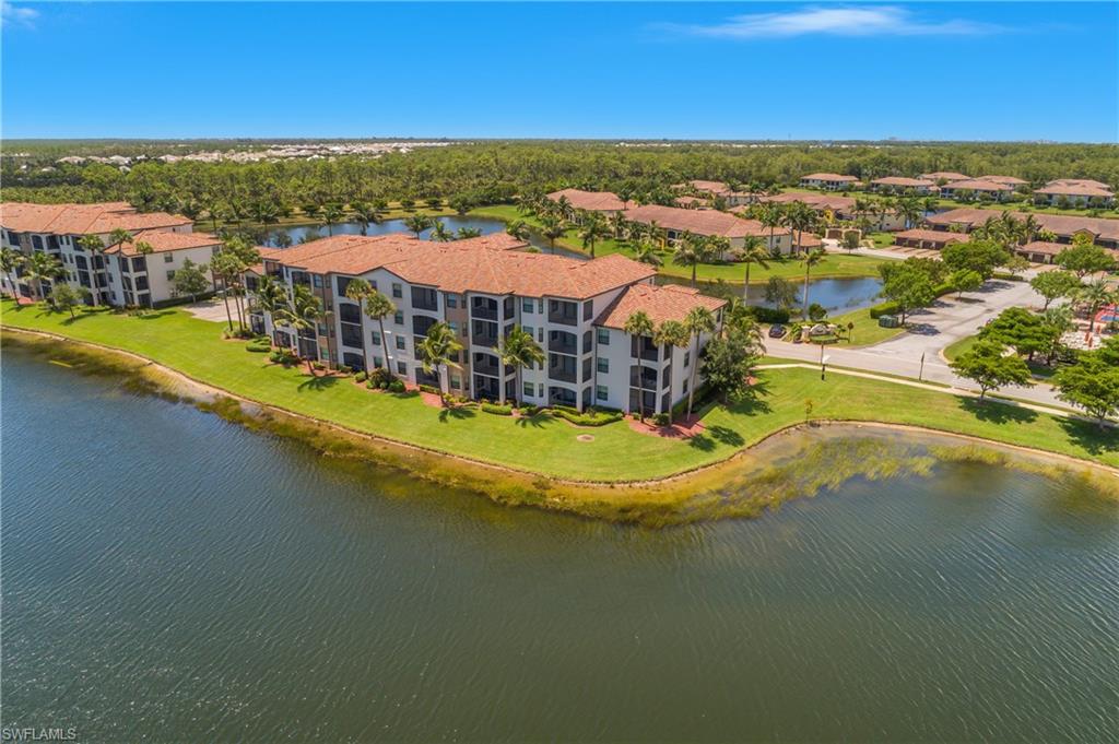 9554 Trevi Court, Unit 4727 Naples, FL 34113 - Photo 33 of 50 an aerial view of residential houses with outdoor space and swimming pool