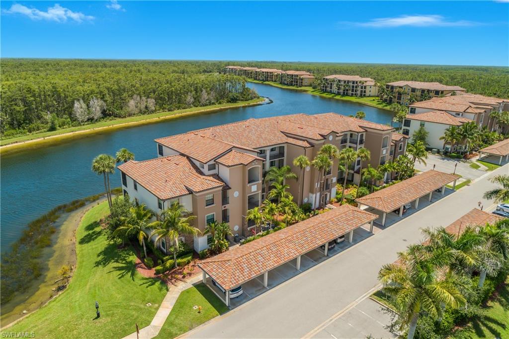 9554 Trevi Court, Unit 4727 Naples, FL 34113 - Photo 34 of 50 an aerial view of a house with a lake view