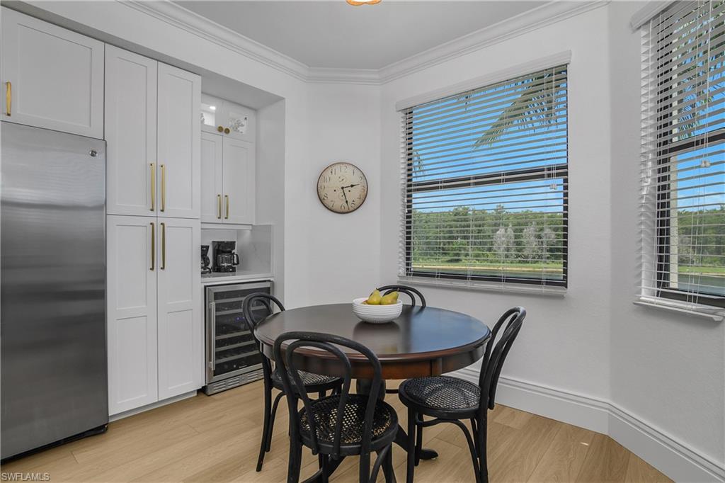 9554 Trevi Court, Unit 4727 Naples, FL 34113 - Photo 7 of 50 a view of a dining room with furniture and window