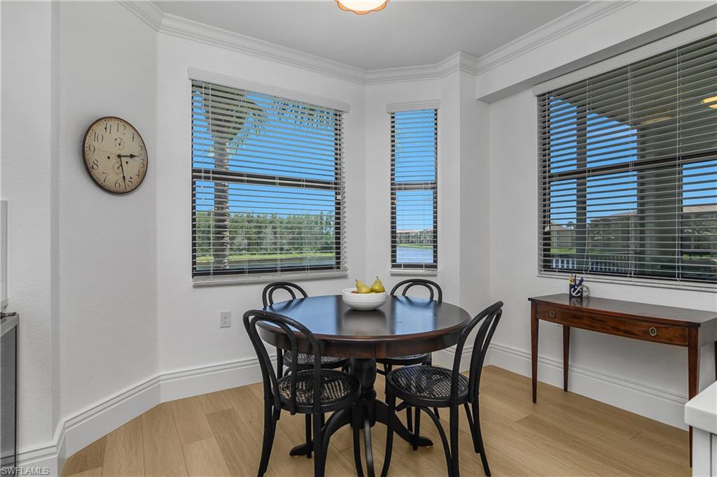 9554 Trevi Court, Unit 4727 Naples, FL 34113 - Photo 8 of 50 a view of a dining room with furniture and window