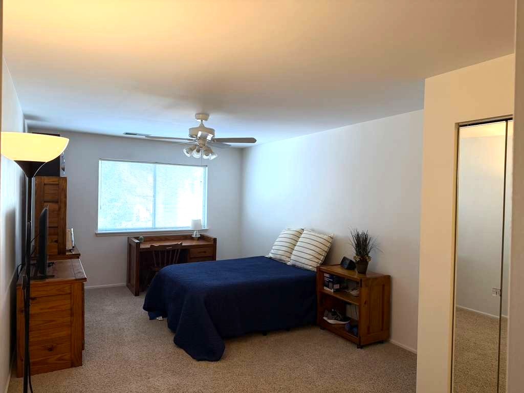 1410 Tulip Court, Unit D2 Wheeling, IL 60090 - Photo 12 of 30 a bedroom with a bed and window