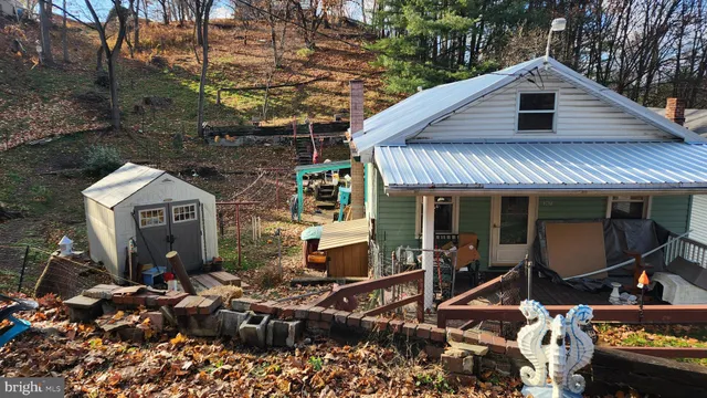 a front view of a house with sitting area