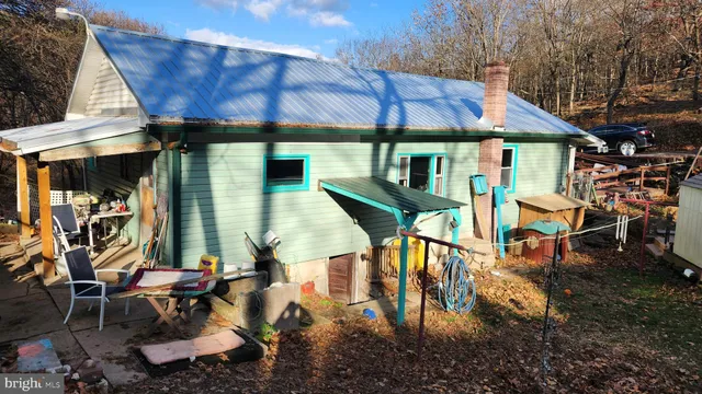 a view of a chairs and table in patio