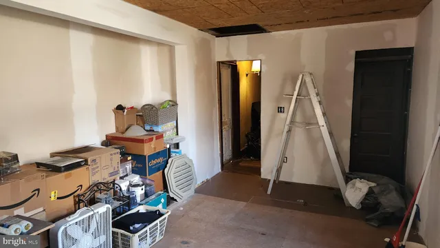 a room with chairs and a wooden door