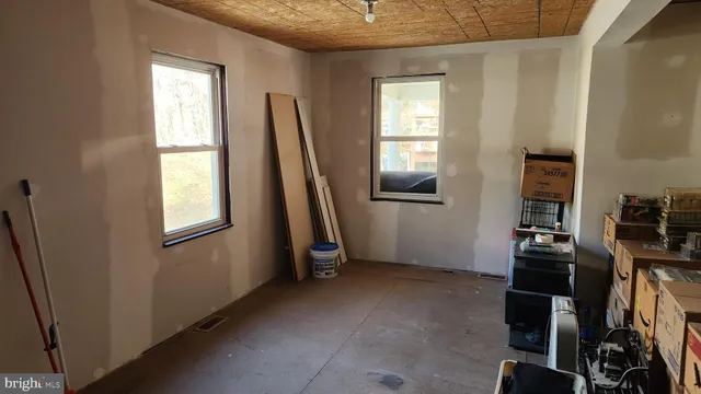 a view of a room with gym equipment and a window