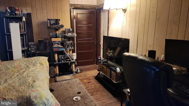 a view of a living room with bathroom