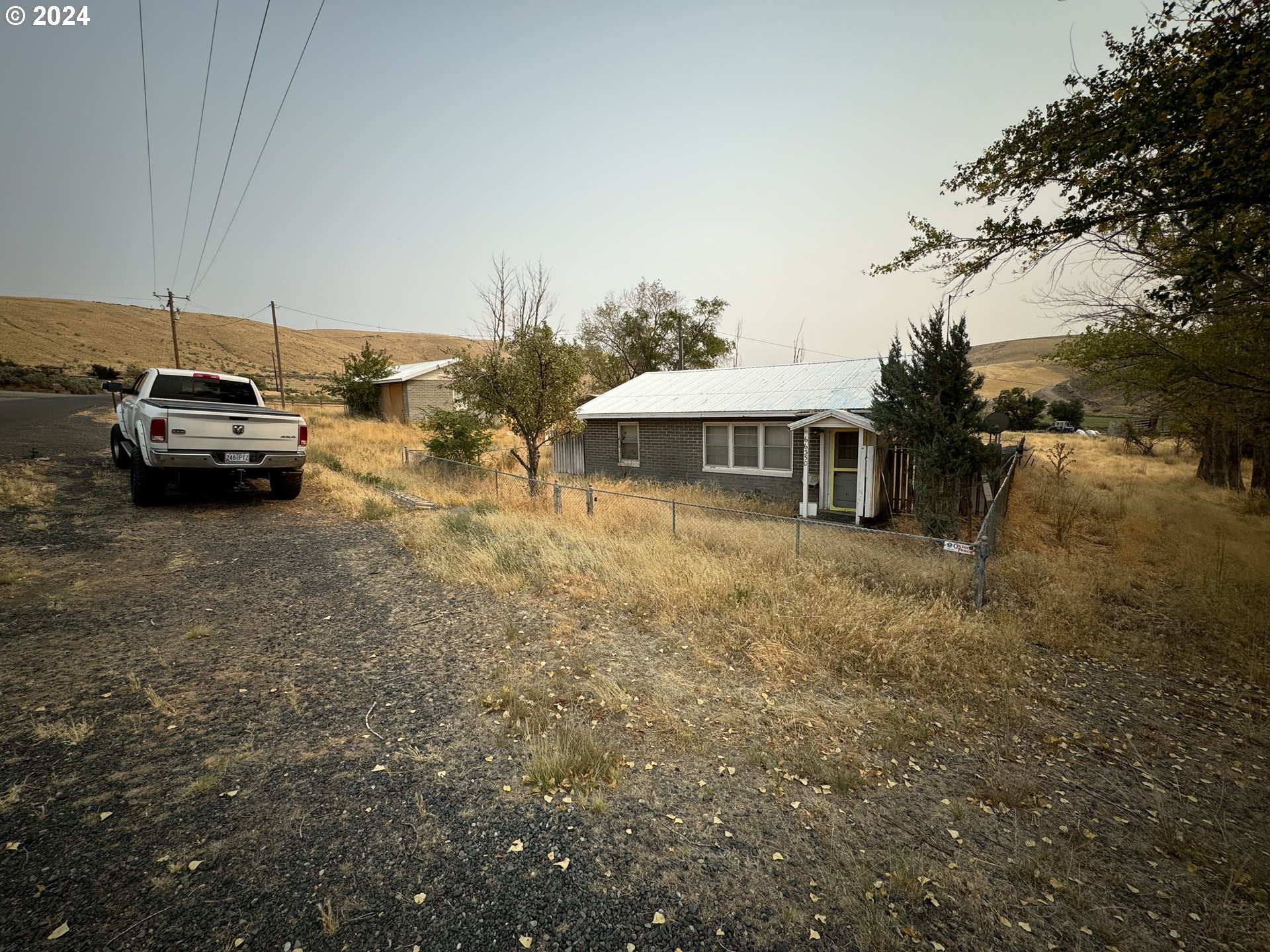 66350 Upper Rock Creek Road Arlington, OR 97812 - Photo 2 of 27 a view of a house with a yard and sitting area