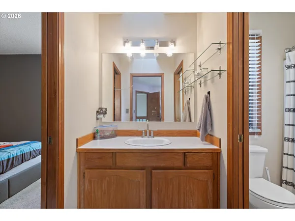 a bathroom with a sink vanity and a mirror