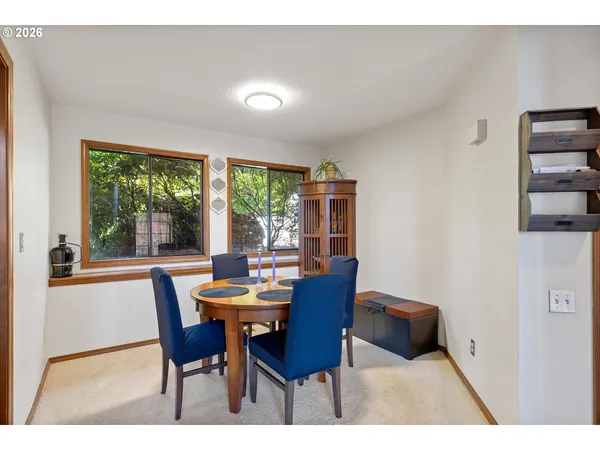 a dining room with furniture and window