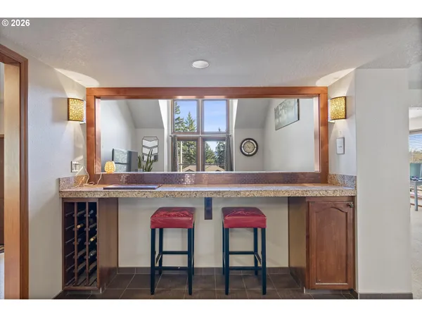 a living room with a table and chairs