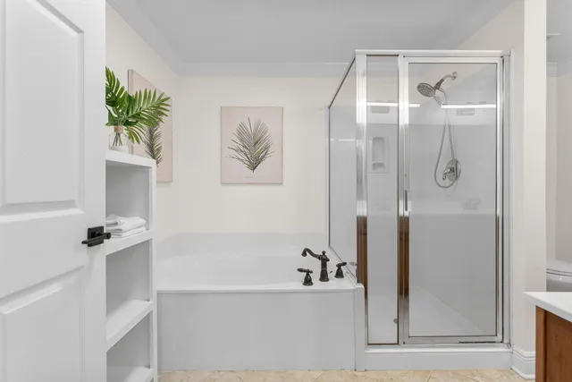 a bathroom with a bathtub and a shower