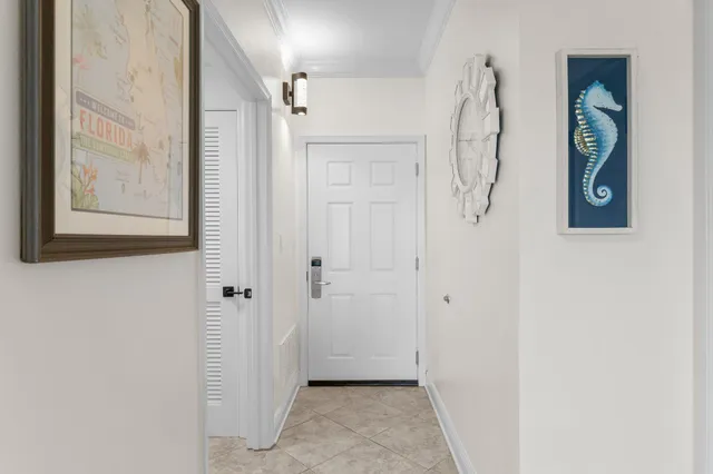a view of a hallway with wooden floor and entryway