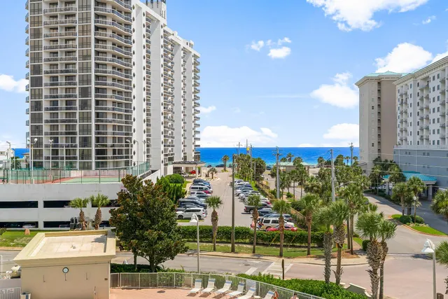 a view of building with yard and staircase