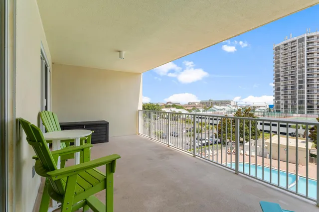 a view of a balcony with furniture