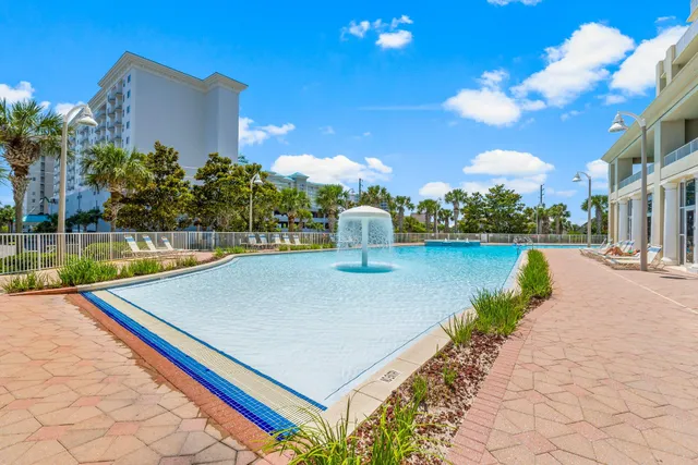 a view of a swimming pool with a patio