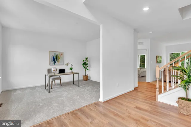 a view of a livingroom with furniture and wooden floor