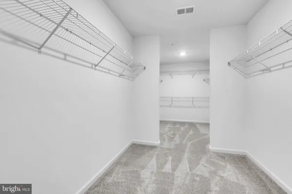 a view of a room with racks on the wall