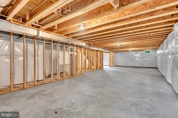 a view of empty room with wooden walls